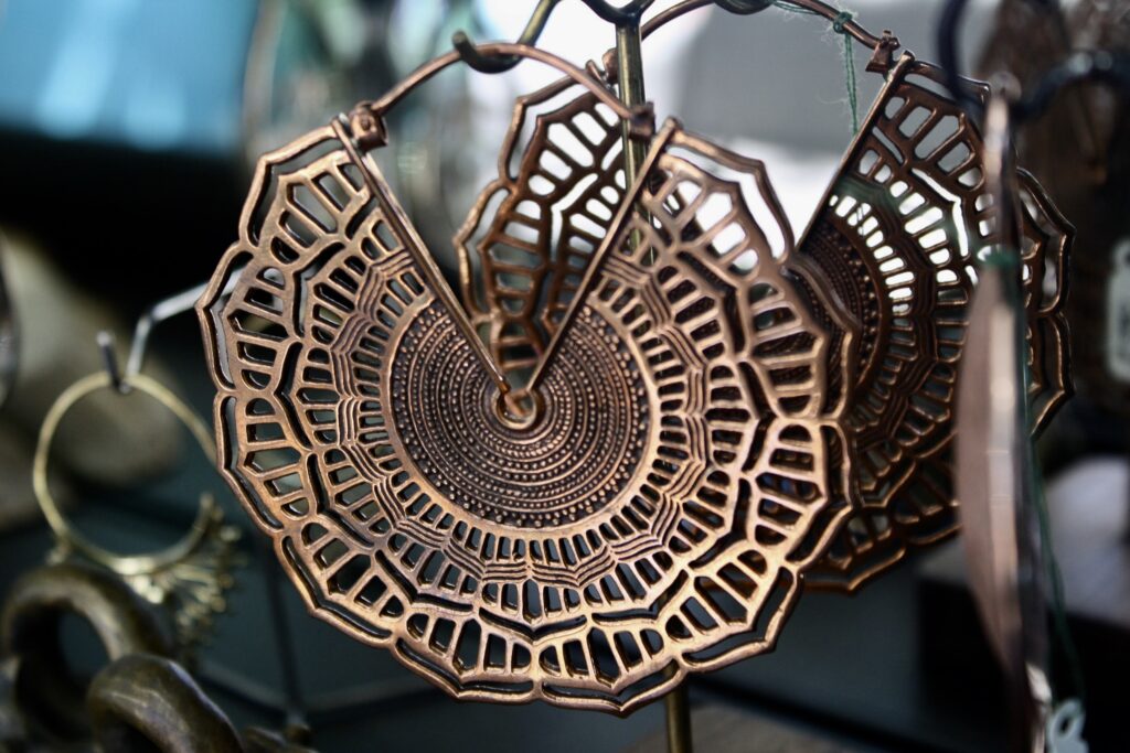 A close up of some wooden earrings