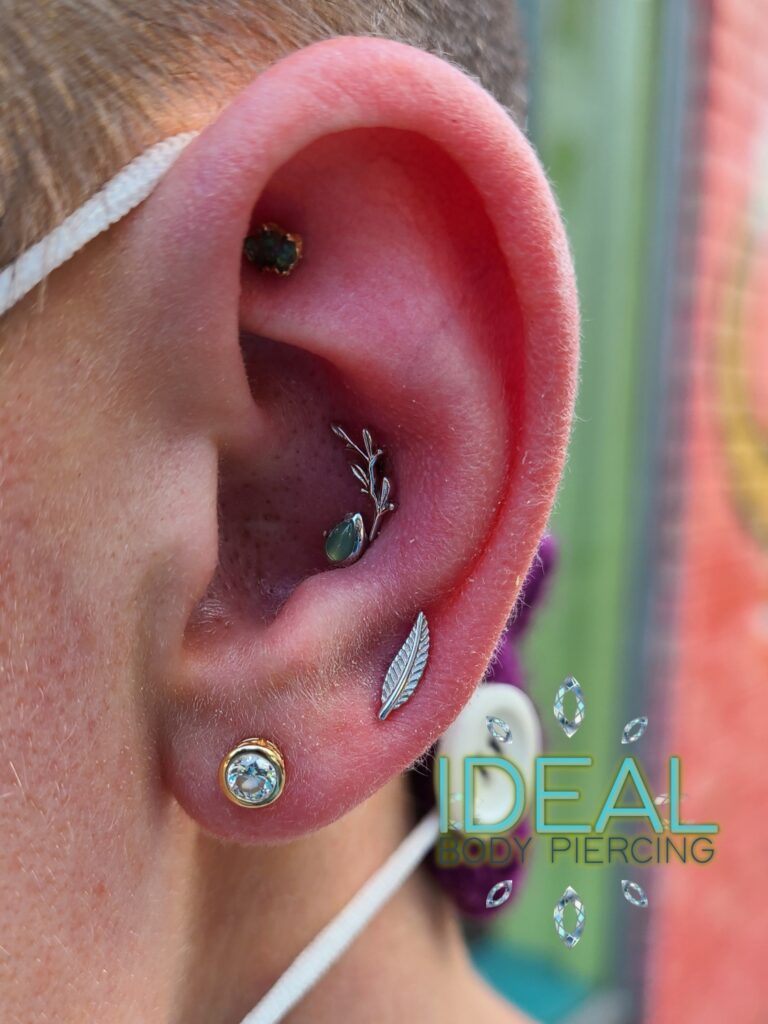 A person with their ear pierced and wearing an earring.